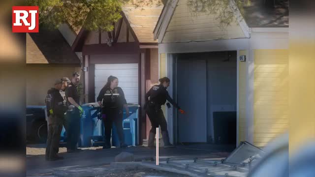 Las Vegas Review Journal News | Police: Man who died after being pulled from house fire was shot several times